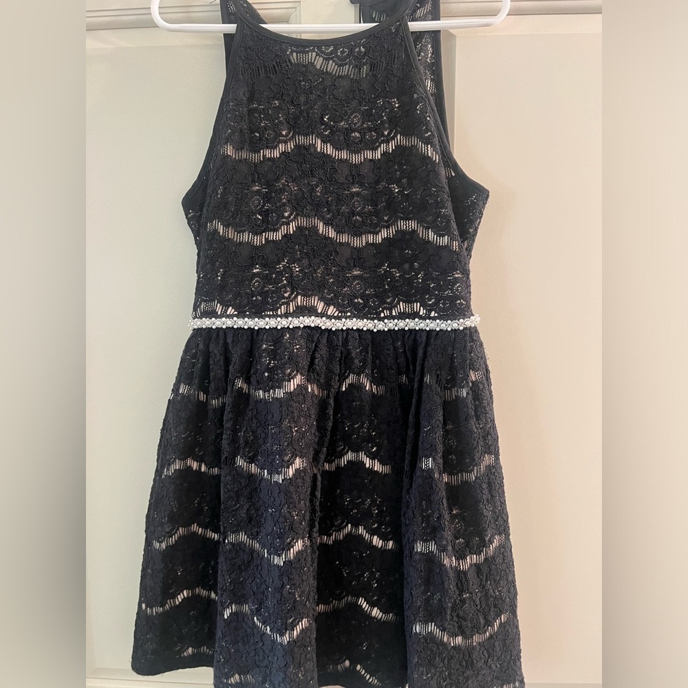 Size 7. Black lace dress with pearls on the waist